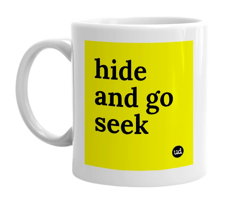 White mug with 'hide and go seek' in bold black letters