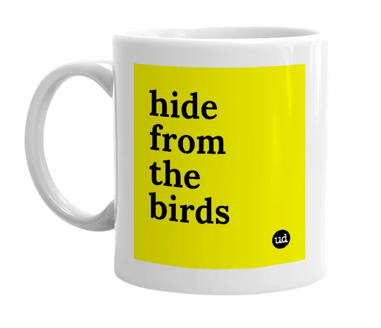 White mug with 'hide from the birds' in bold black letters