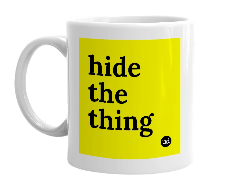 White mug with 'hide the thing' in bold black letters
