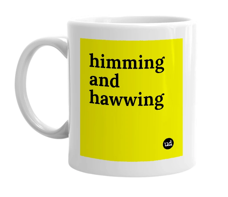 White mug with 'himming and hawwing' in bold black letters