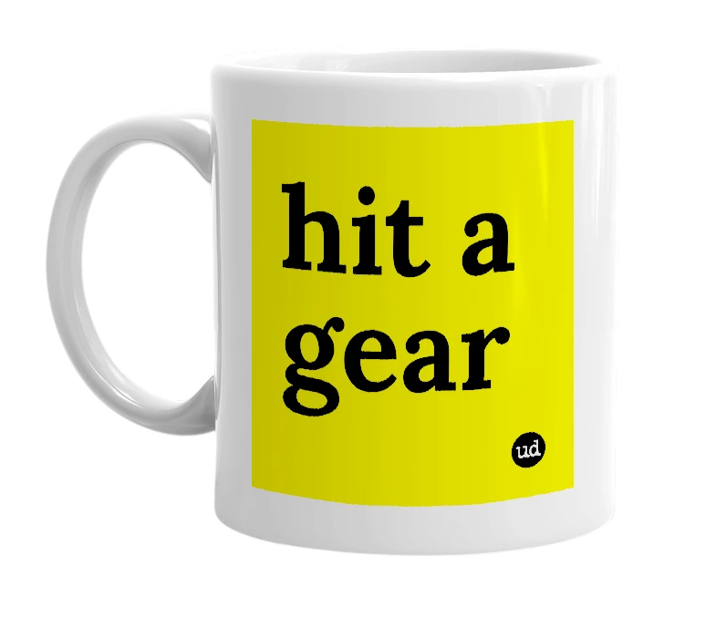 White mug with 'hit a gear' in bold black letters