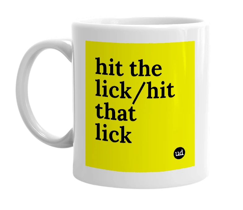 White mug with 'hit the lick/hit that lick' in bold black letters