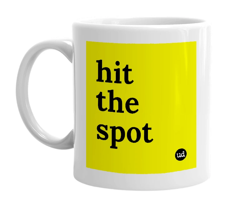 White mug with 'hit the spot' in bold black letters