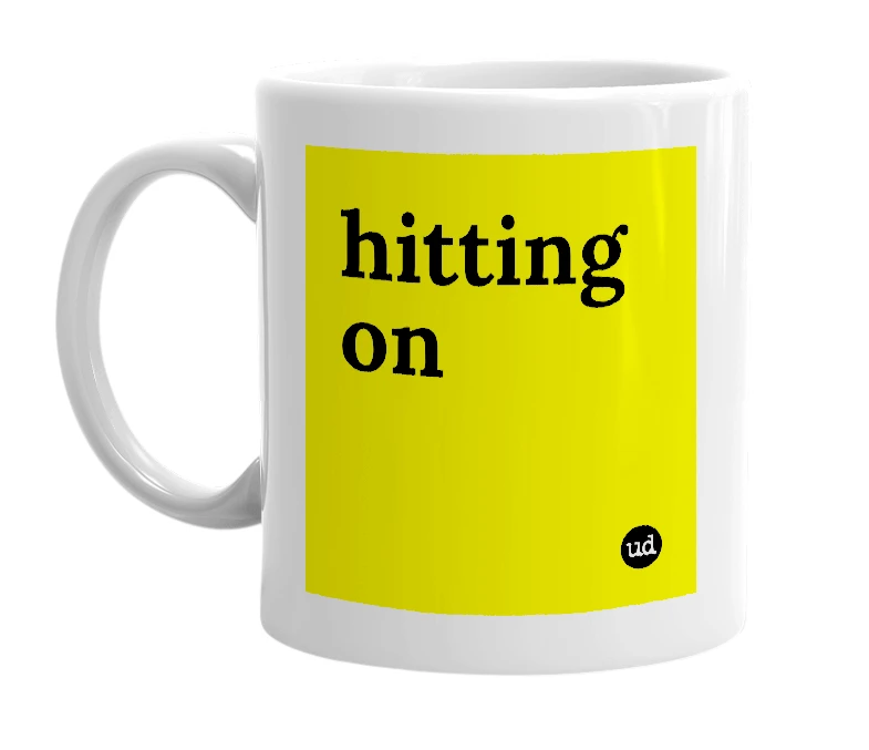 White mug with 'hitting on' in bold black letters