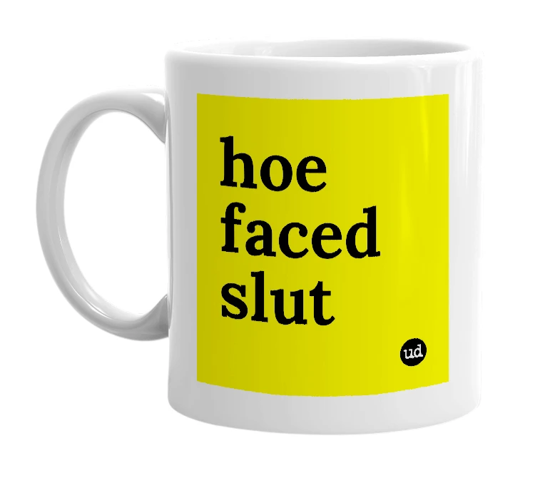 White mug with 'hoe faced slut' in bold black letters