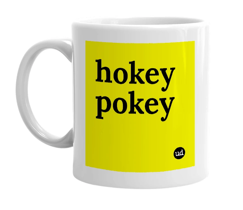 White mug with 'hokey pokey' in bold black letters