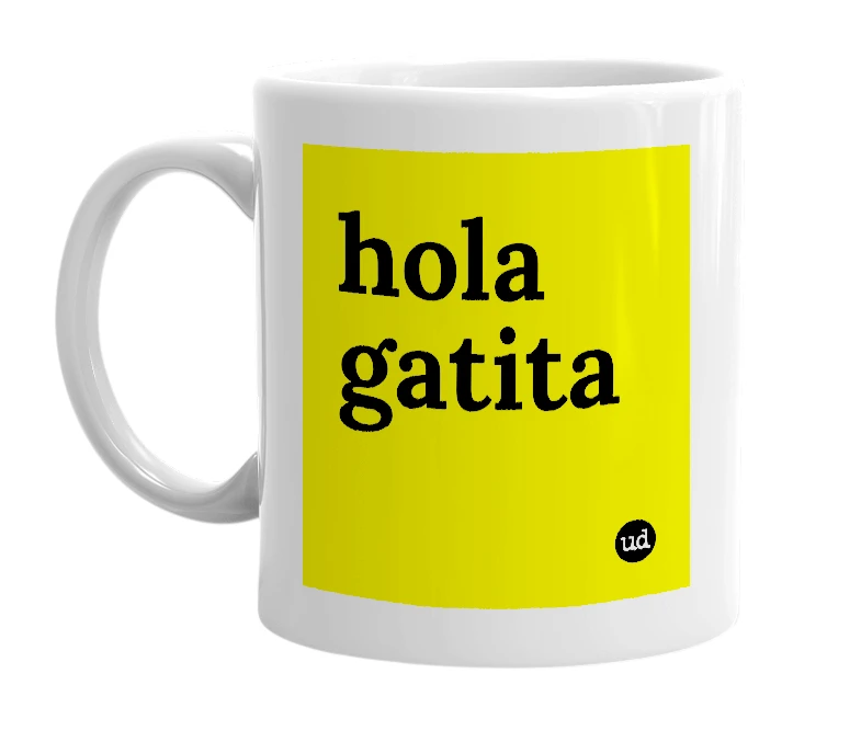 White mug with 'hola gatita' in bold black letters
