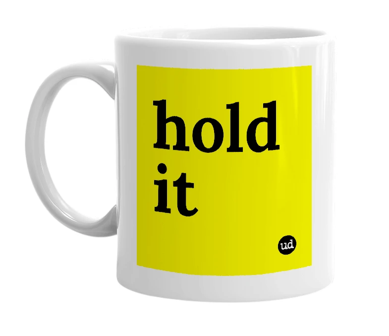 White mug with 'hold it' in bold black letters