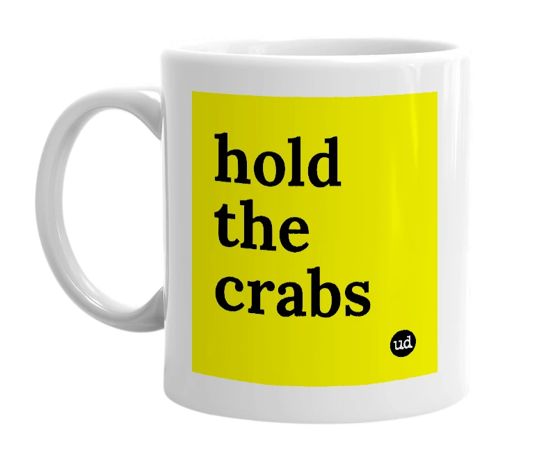 White mug with 'hold the crabs' in bold black letters