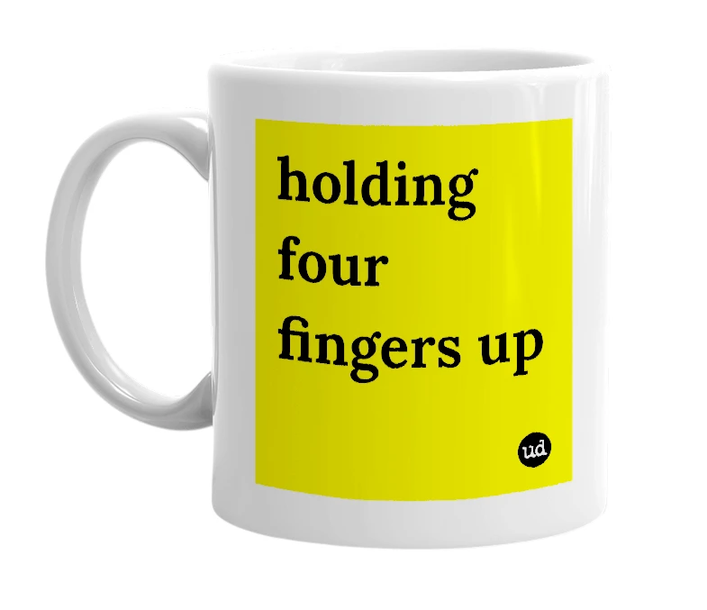 White mug with 'holding four fingers up' in bold black letters