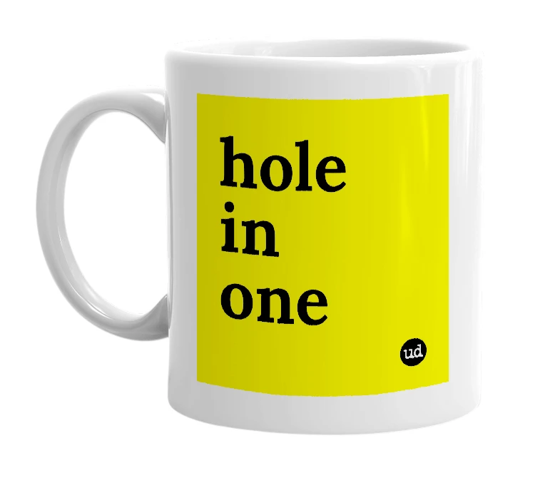 White mug with 'hole in one' in bold black letters