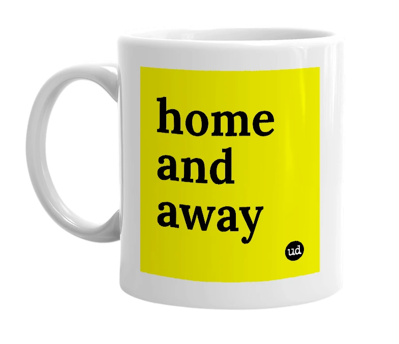 White mug with 'home and away' in bold black letters