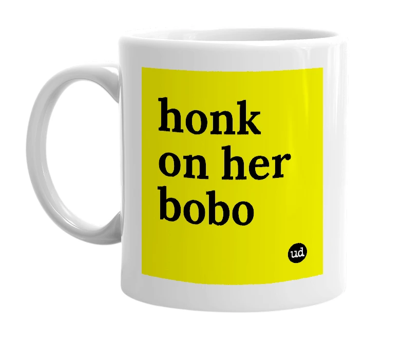 White mug with 'honk on her bobo' in bold black letters