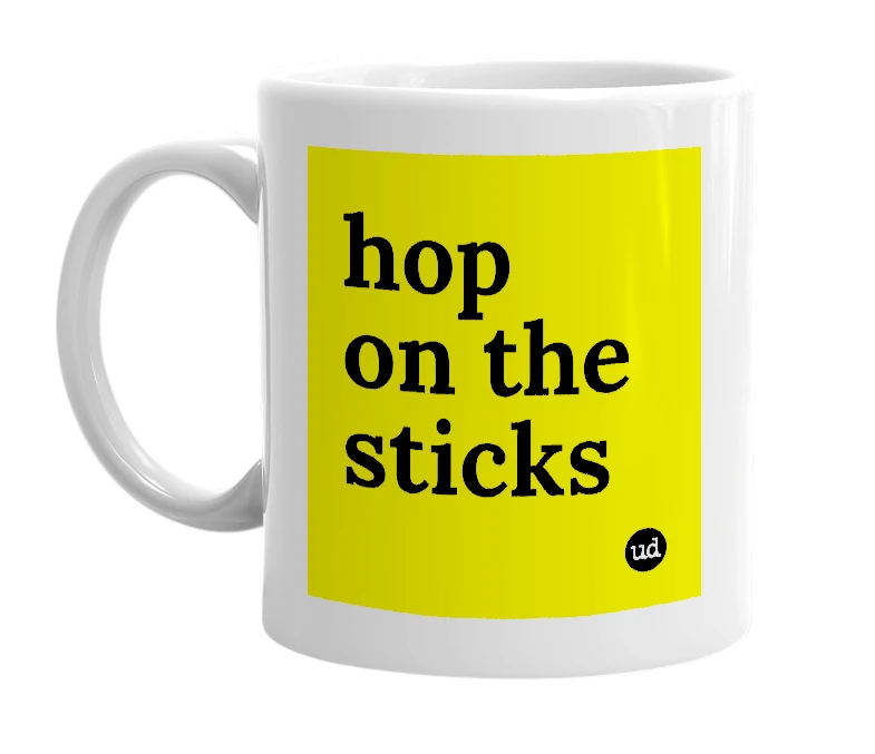 White mug with 'hop on the sticks' in bold black letters
