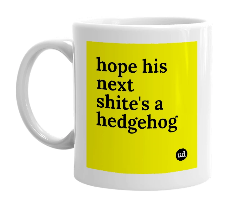 White mug with 'hope his next shite's a hedgehog' in bold black letters