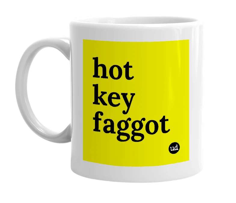 White mug with 'hot key faggot' in bold black letters