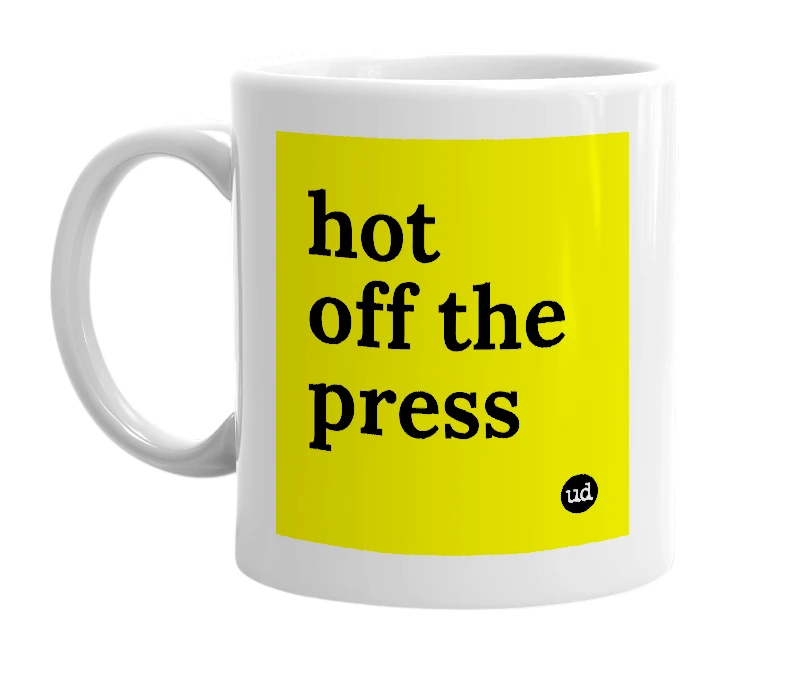 White mug with 'hot off the press' in bold black letters