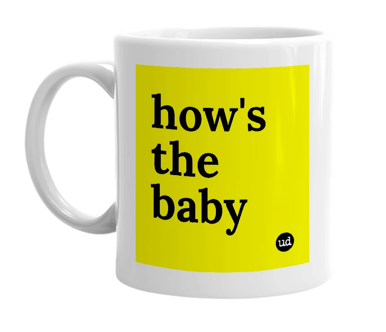 White mug with 'how's the baby' in bold black letters