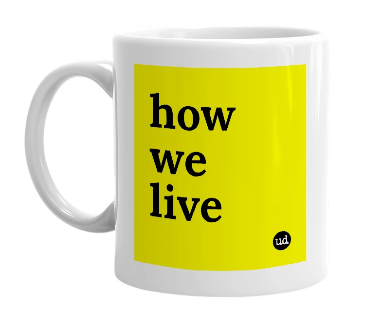 White mug with 'how we live' in bold black letters