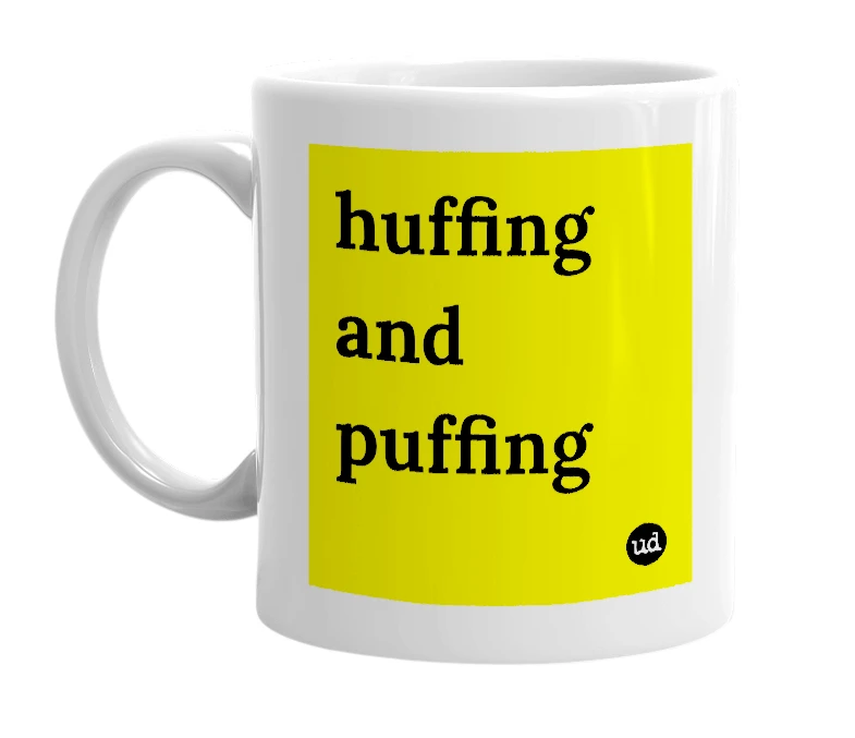 White mug with 'huffing and puffing' in bold black letters