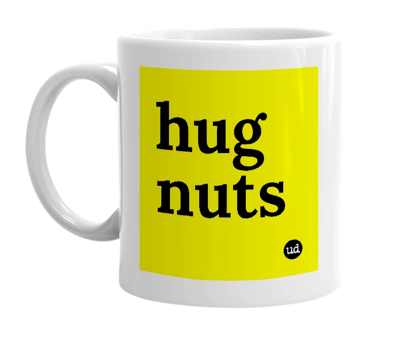 White mug with 'hug nuts' in bold black letters