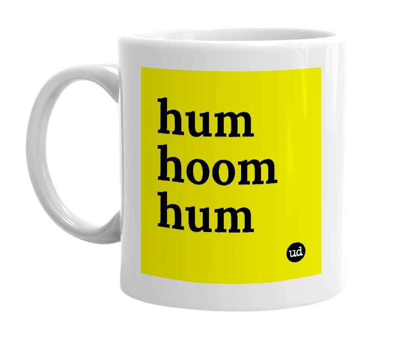 White mug with 'hum hoom hum' in bold black letters