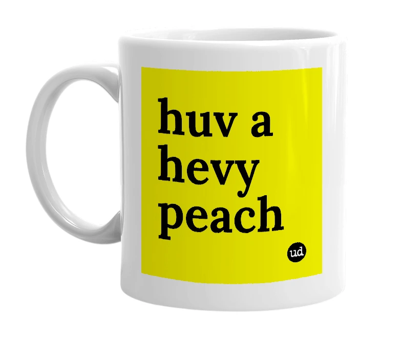 White mug with 'huv a hevy peach' in bold black letters