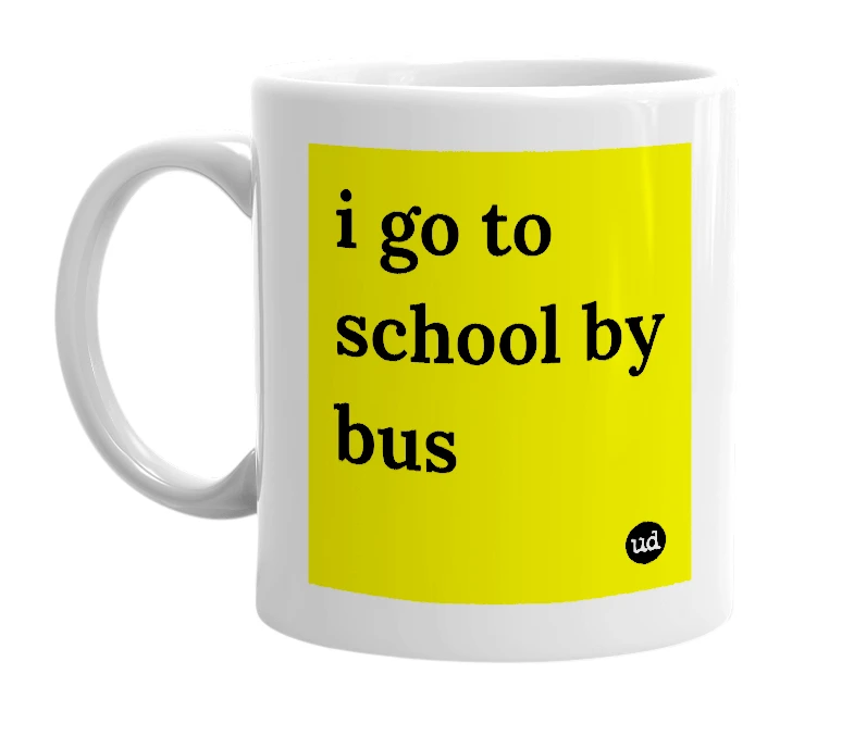 White mug with 'i go to school by bus' in bold black letters