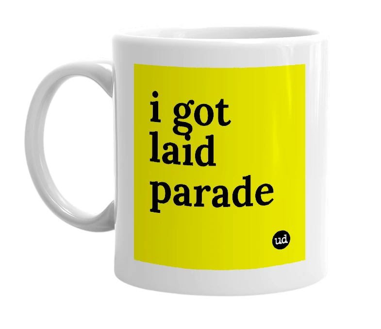 White mug with 'i got laid parade' in bold black letters