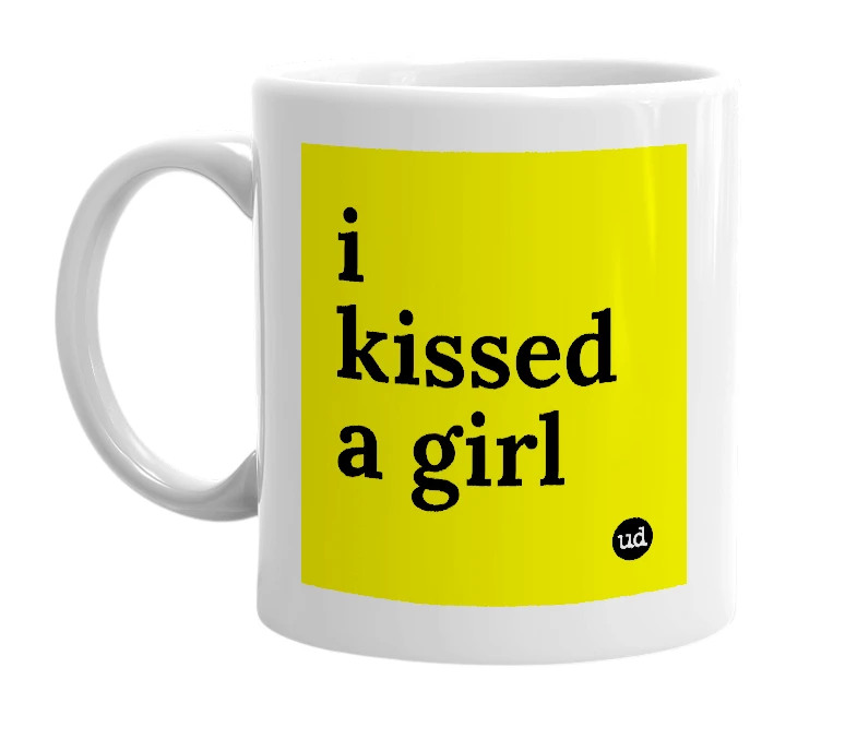 White mug with 'i kissed a girl' in bold black letters