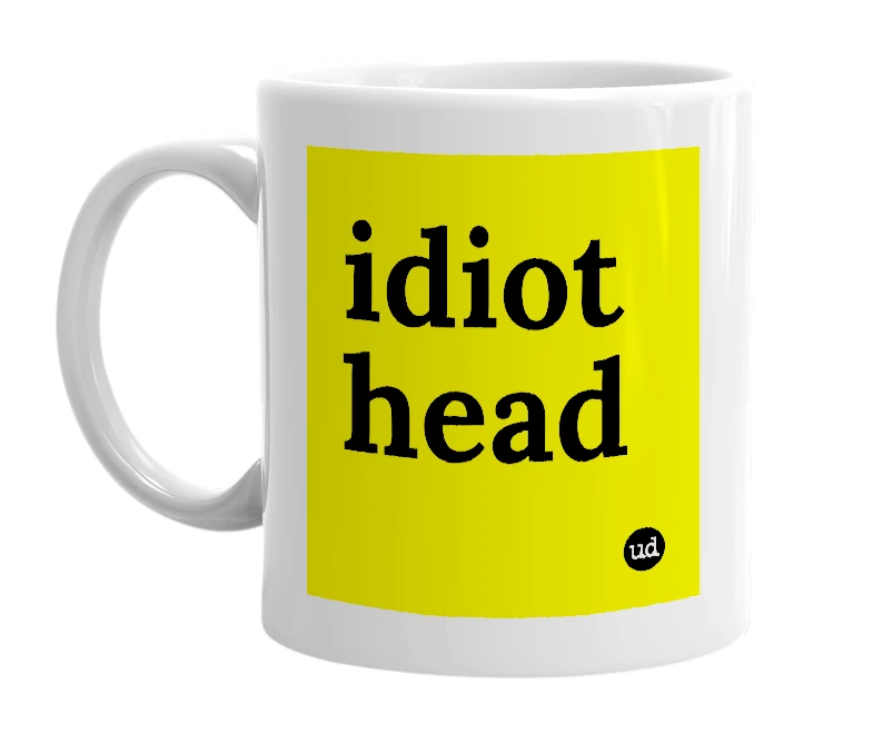 White mug with 'idiot head' in bold black letters