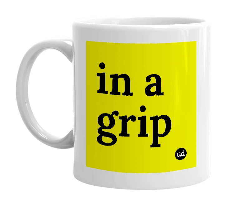 White mug with 'in a grip' in bold black letters