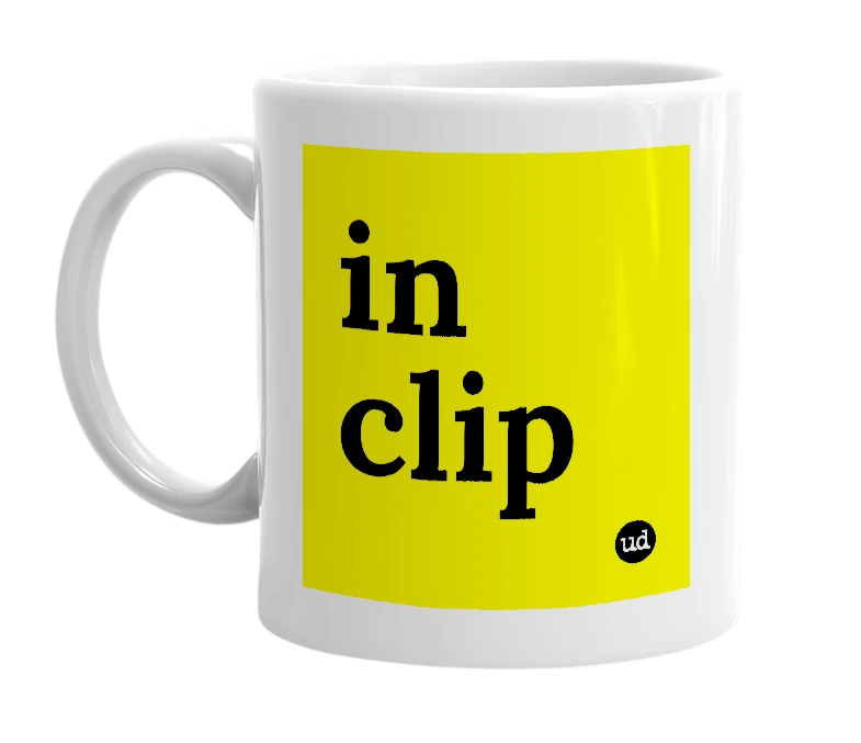 White mug with 'in clip' in bold black letters