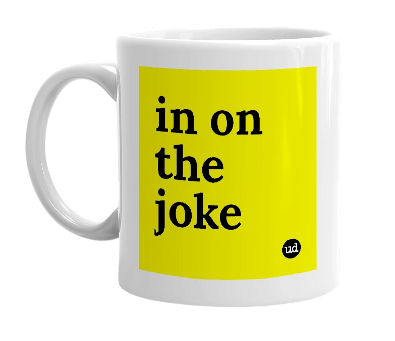 White mug with 'in on the joke' in bold black letters