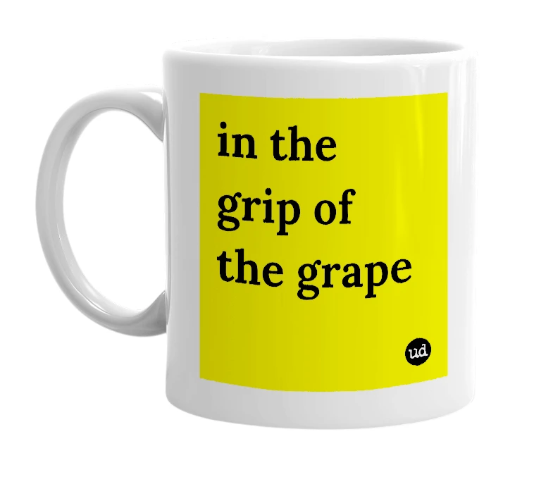 White mug with 'in the grip of the grape' in bold black letters