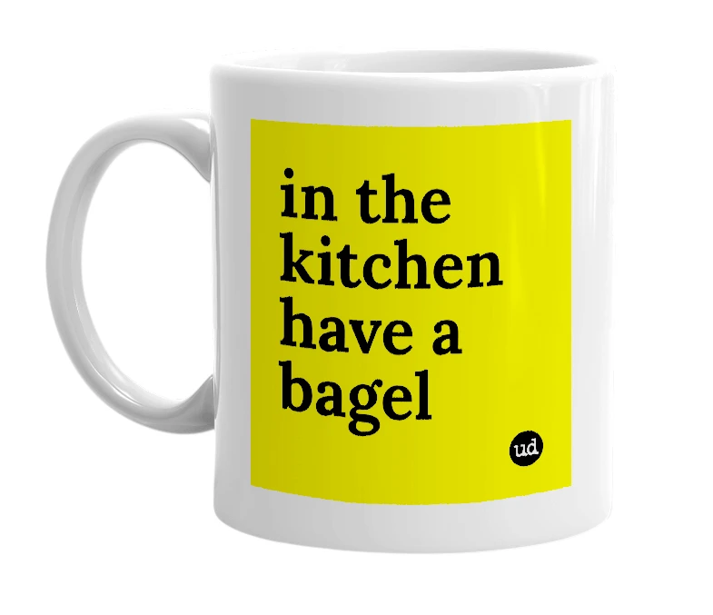 White mug with 'in the kitchen have a bagel' in bold black letters