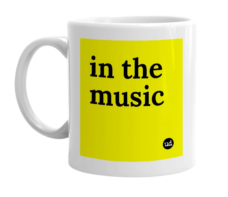 White mug with 'in the music' in bold black letters