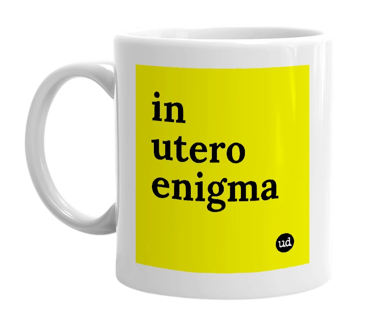 White mug with 'in utero enigma' in bold black letters