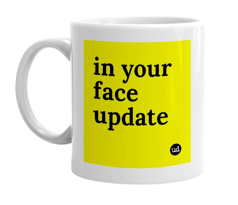 White mug with 'in your face update' in bold black letters