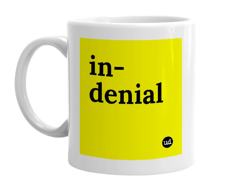 White mug with 'in-denial' in bold black letters