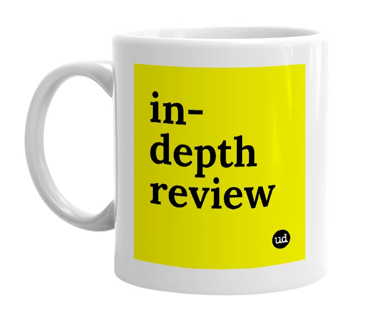 White mug with 'in-depth review' in bold black letters