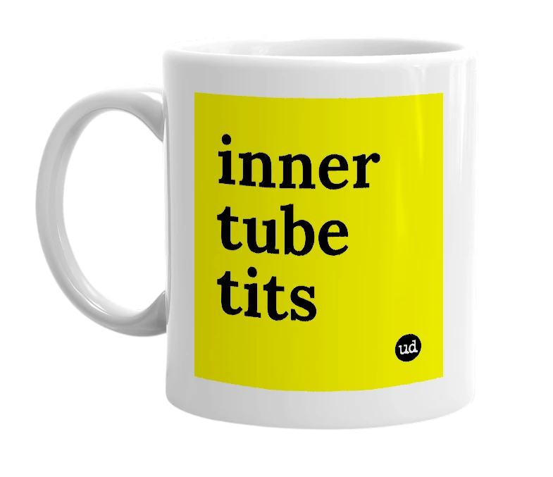 White mug with 'inner tube tits' in bold black letters