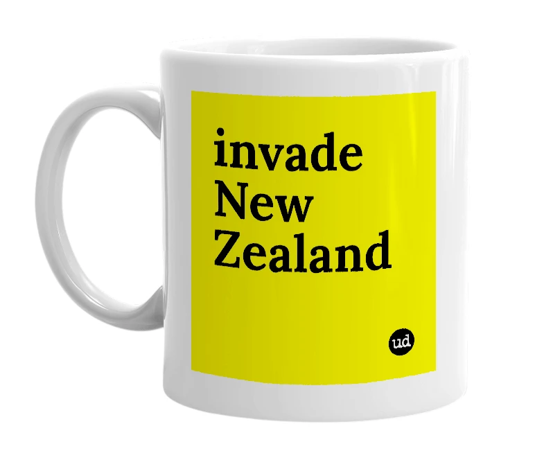 White mug with 'invade New Zealand' in bold black letters