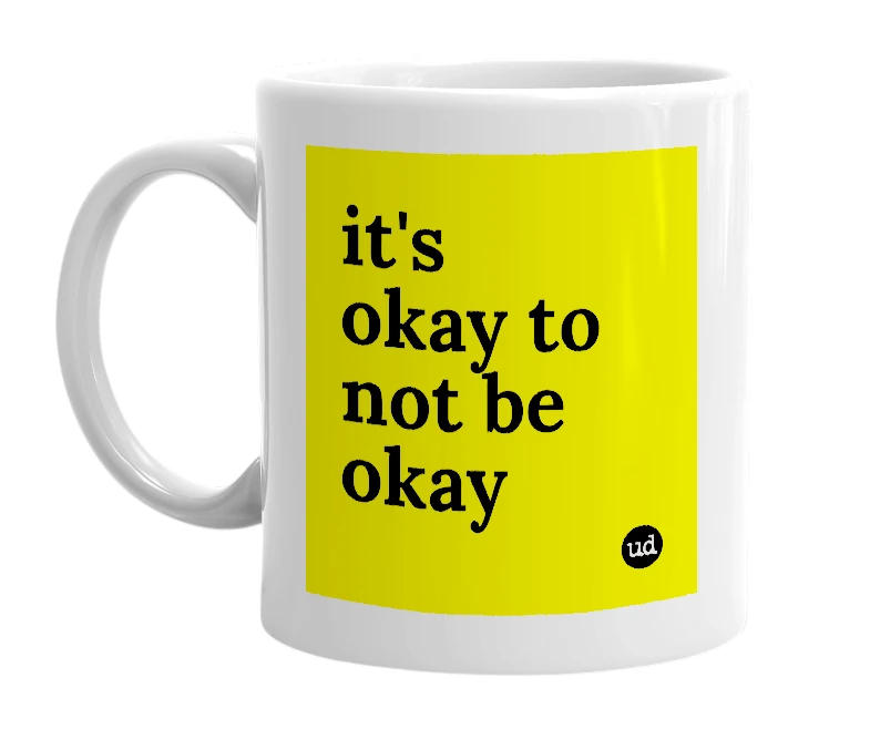 White mug with 'it's okay to not be okay' in bold black letters