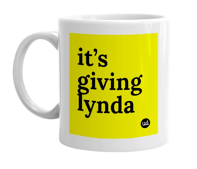 White mug with 'it’s giving lynda' in bold black letters