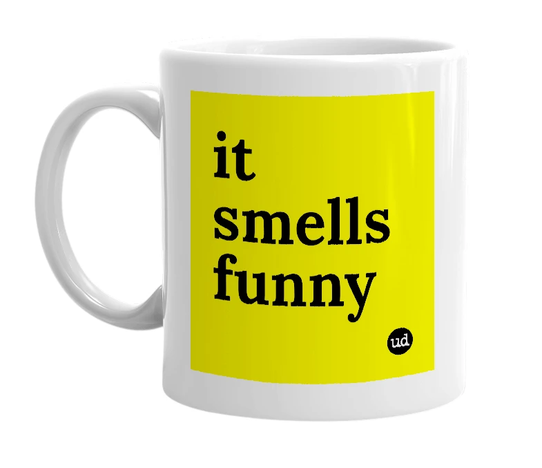White mug with 'it smells funny' in bold black letters
