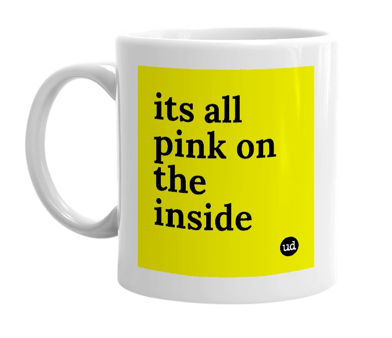 White mug with 'its all pink on the inside' in bold black letters