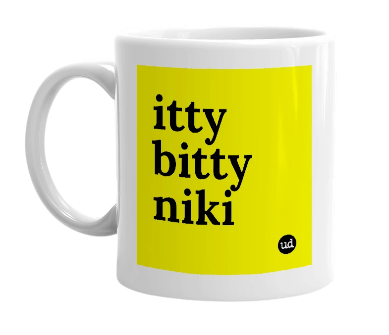 White mug with 'itty bitty niki' in bold black letters