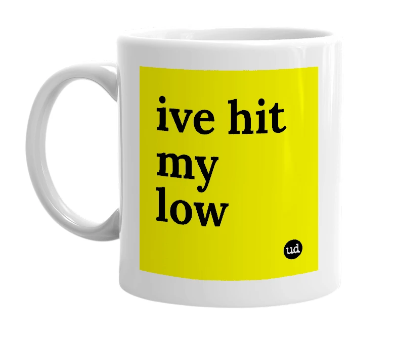 White mug with 'ive hit my low' in bold black letters