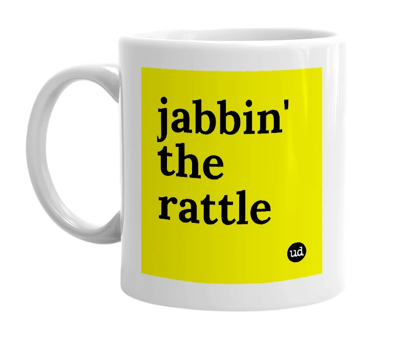 White mug with 'jabbin' the rattle' in bold black letters